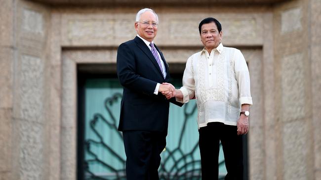 Malaysia's Prime Minister Najib Razak left, greets Philippine President Rodrigo Duterte during a welcoming ceremony on Thursday. Picture: AFP