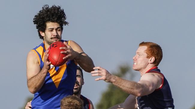 Kirk Dickson with the ball for Cranbourne. Picture: Valeriu Campan