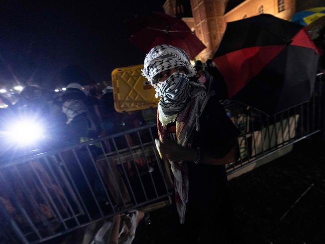 A pro-Palestinian demonstrator looks on during a brief break in the clashes with counter protesters at UCLA. Picture: AFP