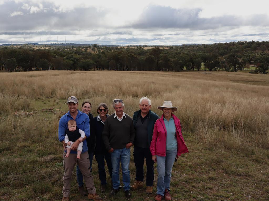 The separate Smith family's stand in support of the proposed Pikedale Wind Farm, with their properties sitting in the middle of the proposed site. (from left) Ken, Alexander and Sofia Smith, Cath and Gordon Smith, Clive and Margaret Smith. Photo: Jessica Klein
