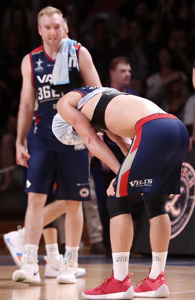 Anthony Drmic puts his jersey over his face after Cameron Gliddon hit the game-winner for Brisbane on Sunday. Picture: Sarah Reed.