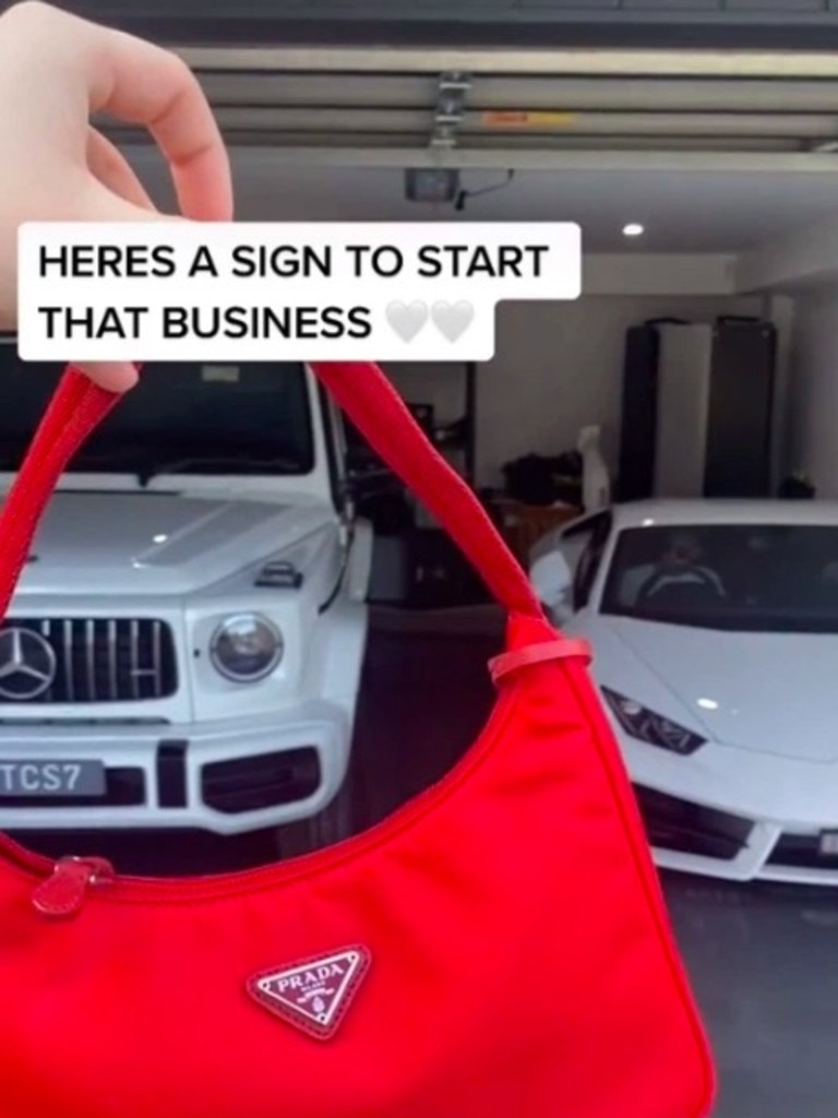 Paris showing off her Prada handbag alongside a Lamborghini and Merc.