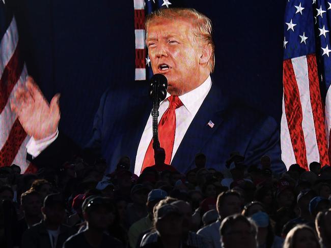 US President Donald Trump is shown on a screen as he speaks during the Independence Day events at Mount Rushmore. Picture: AFP