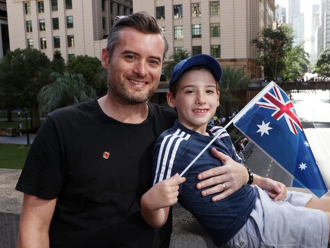Owen Millar, 44, of Cannon Hill, with son Cian Millar, 7, at the ANZAC day march, Brisbane. Picture: Liam Kidston