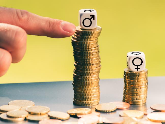 Symbol for unequal payment. Gender symbols on different high stacks of coins. Gender pay gap. Gender inequality. Pay inequality. Picture: iStock