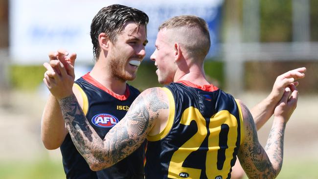 Former Magpies-turned-Crows Paul Seedsman and Ben Crocker celebrate a goal in the under-23s game against Port Adelaide on Saturday. Picture: AAP Image/David Mariuz