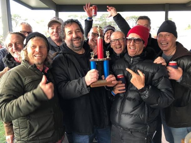 Mick Molloy shows off his under 15 best and fairest trophy at Mt Eliza.