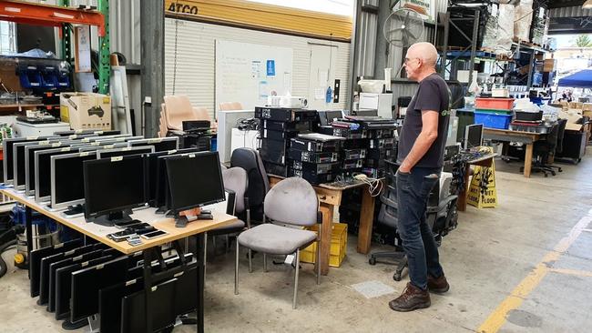 Substation 33 founder Tony Sharp with some of the screens that will be given to needy kids in Logan.