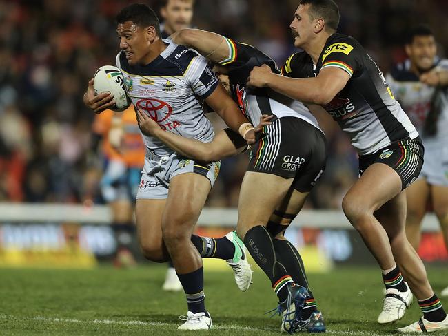 Cowboys forward John Asiata is tackled during the loss to Penrith. Picture: Getty Images