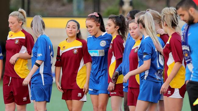 Players from Skye United’s women’s team took the field for an emotional minute’s silence in honour of Laa Chol. Picture: Stuart McEvoy