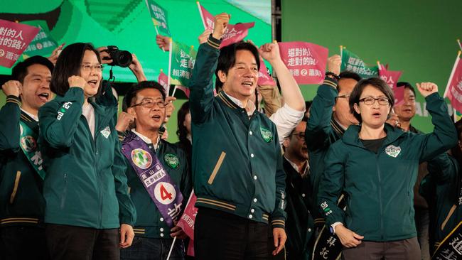 Taiwan presidential candidate Lai Ching-te, centre, his running mate Hsiao Bi-khim, right, and President Tsai Ing-wen, left, at a campaign rally in Kaohsiung on Sunday. Picture: AFP