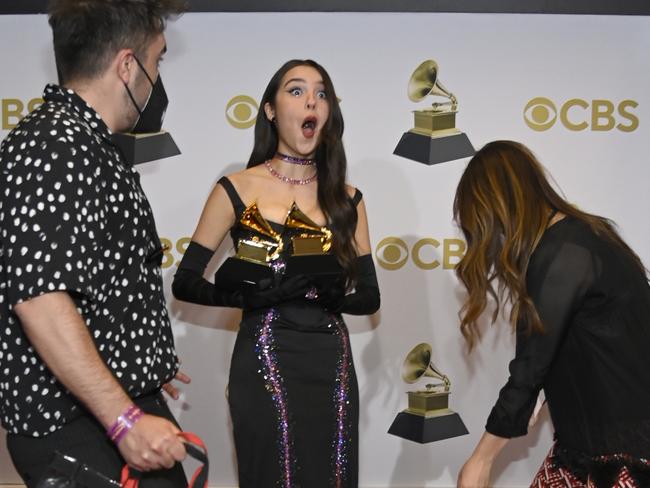 LAS VEGAS, NEVADA - APRIL 03: Olivia Rodrigo winner of the Best New Artist and Best Pop Solo Performance Award for 'Drivers License' poses in the winners photo room during the 64th Annual GRAMMY Awards at MGM Grand Garden Arena on April 03, 2022 in Las Vegas, Nevada. (Photo by David Becker/Getty Images for The Recording Academy)