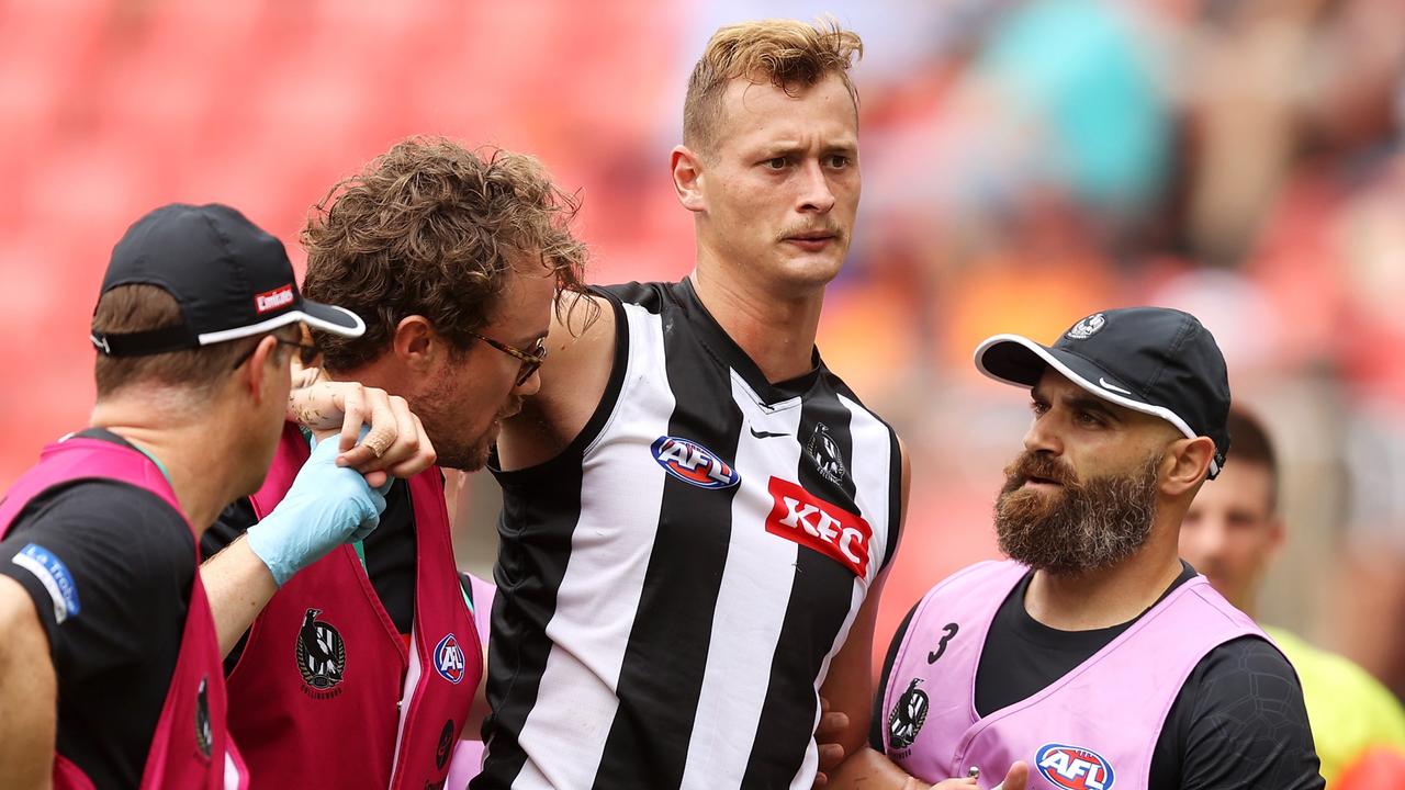 Nathan Kreuger is helped off after a head knock. Picture: Mark Kolbe/Getty Images