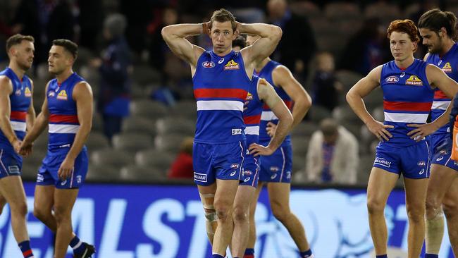 Dale Morris and his Bulldogs teammates can’t believe what has happened on the final siren. Picture: Michael Klein