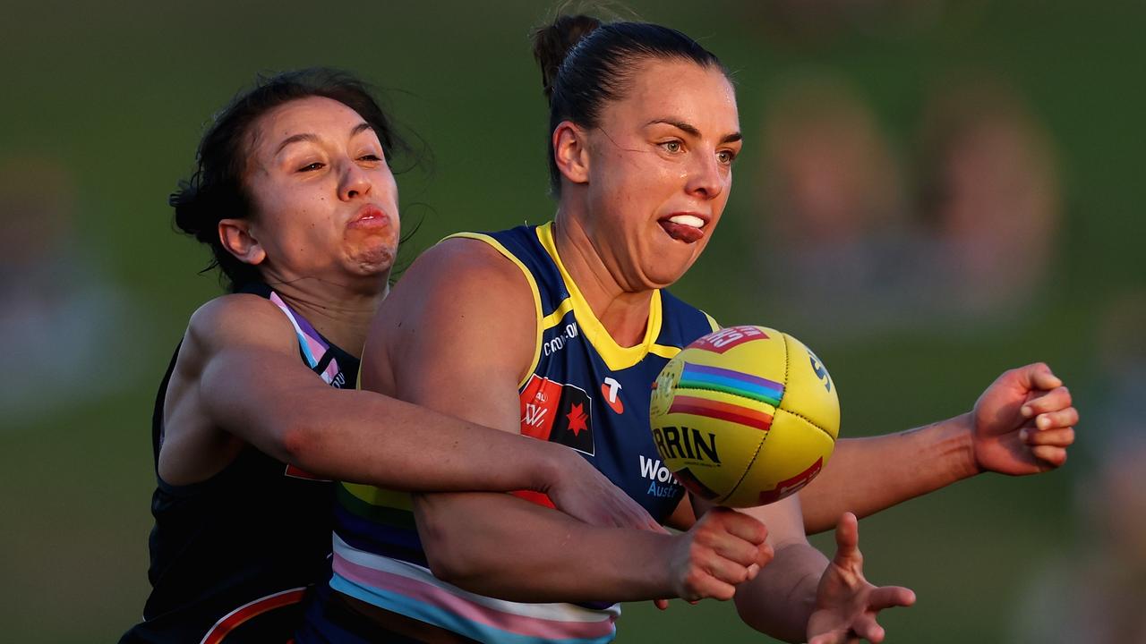 SYDNEY, AUSTRALIA - OCTOBER 13: Ebony Marinoff of the Crows is tackled by Rebecca Beeson of the Giants during the round seven AFLW match between Greater Western Sydney Giants and Adelaide Crows at Henson Park, on October 13, 2024, in Sydney, Australia. (Photo by Cameron Spencer/Getty Images)