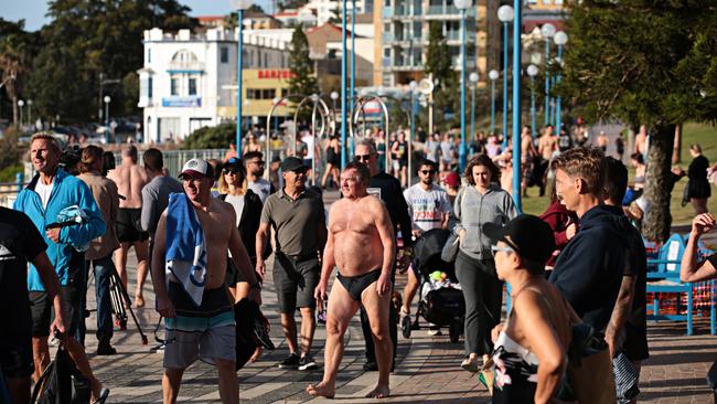 Large crowds flock to Coogee Beach in Sydney’s eastern suburbs on Sunday morning in an attempt to beat the 9am lockdown curfer. Picture: Adam Yip