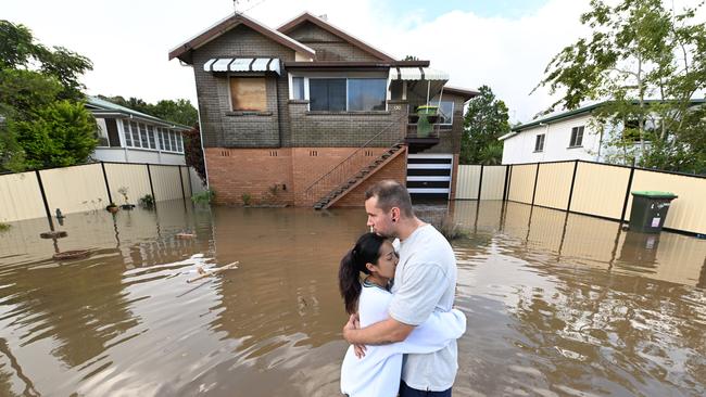 ‘I just wish it would stop’: John Skudder and partner Amy Parker at their Lismore home – flooded for a second time in a matter of weeks. Picture: Lyndon Mechielsen