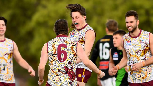 Dareo Rogers of Murrumbeena is congratulated by team mates after kicking a goal during the Southern Football Netball League 2023 Division 2 Senior match between Murrumbeena and Doveton Doves at Murrumbeena Park in Murrumbeena, Victoria on July 8, 2023. (Photo by Josh Chadwick)