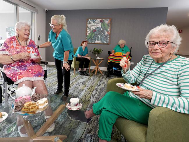 L to R, residents  Fay Comloquoy, Denise Horchner, Norma Webb, and staff Kristella Gates RN, Vanessa Scales EN, Despite nationwide staff shortages, government data shows this home is one of the most caring in the country, Seasons Seniors Living,  Mango Hill, on Tuesday 16th January 2024 - Photo Steve Pohlner