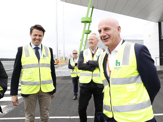 Premier Peter Gutwein (right) at Hobart Airport alongside Senator Jonno Duniam and Tourism Tasmania CEO John Fitzgerald. Picture: Zak Simmonds