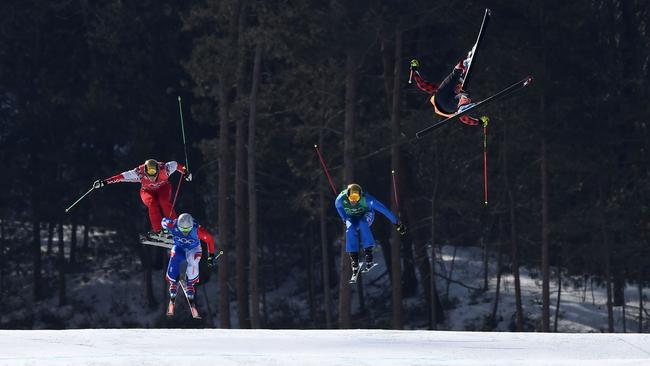 Christopher Del Bosco of Canada crashes in the Freestyle Skiing Men's Ski Cross.