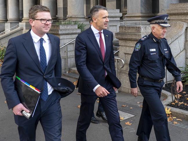 Health Minister Chris Picton, Premier Peter Malinauskas and Police Commissioner Grant Stevens walk to Government House for an Executive Council meeting. Picture : NCA NewsWire / Naomi Jellicoe