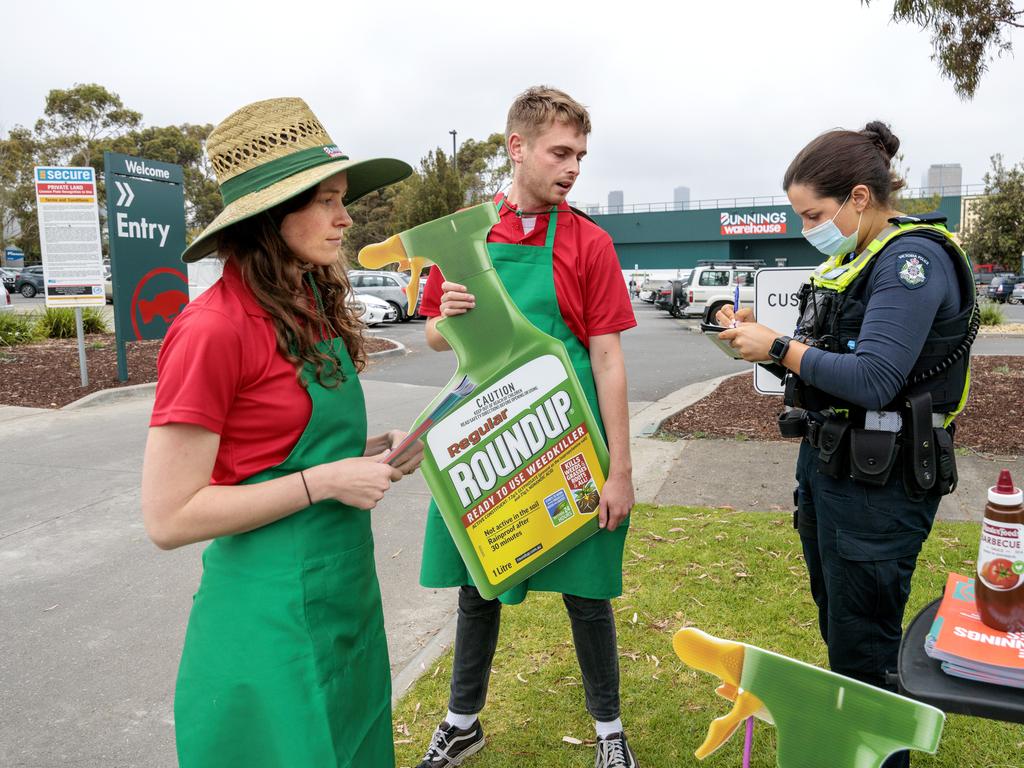 Consumer group SumOfUs are spoken to by police while protesting about the sale of Roundup up outside Port Melbourne Bunnings. Picture: NCA NewsWire / David Geraghty