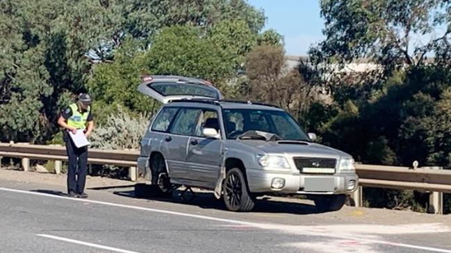 The 4WD the pedestrian had parked on the side of the freeway. The tire had yet to be replaced by the time of the collision. Picture: George Yankovich