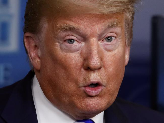 President Donald Trump speaks about the coronavirus in the James Brady Press Briefing Room of the White House, Thursday, April 23, 2020, in Washington, as Vice President Mike Pence listens. (AP Photo/Alex Brandon)