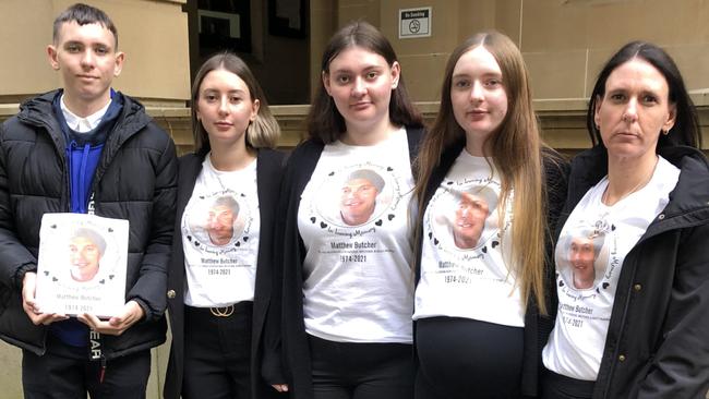 Matthew Butcher's wife Michelle Butcher (far right) with their four children, (left to right) Ryan, Tneil, Skye and Kirralee, all wearing T-shirts with Mr Butcher’s portrait, outside Central Local Court in Sydney on April 21, after a sentencing hearing for the truck driver Adam Moule. Picture: Jim O'Rourke