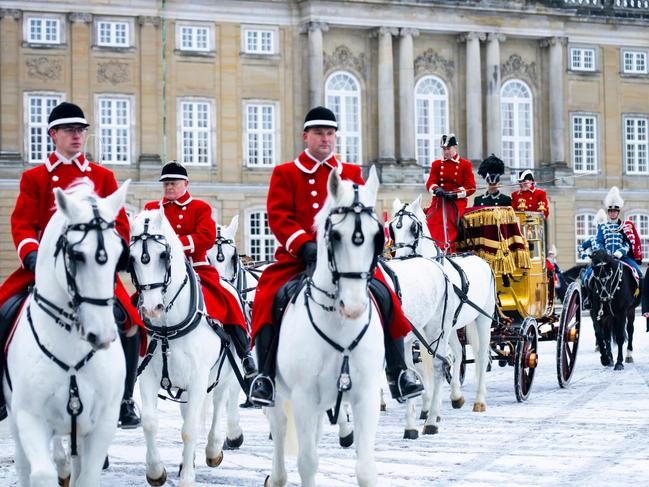 Queen Margrethe II of Denmark sits in the golden carriage as she is escorted by the Gardehusar Regiment's Horseskort from Christian IX's Palace, Amalienborg to Christiansborg Palace in Copenhagen for the New Year's reception, on January 4, 2024. Picture: AFP