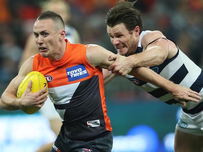 Giants Tom Scully breaks clear from a tackle by Geelong's Patrick Dangerfield during AFL match GWS Giants v Geelong Cats at Spotless Stadium. Picture. Phil Hillyard