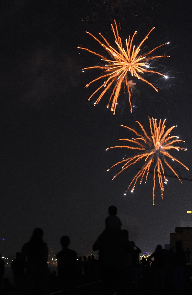 Sri Lankans watch fireworks during new year's celebrations in Colombo. Picture: AFP