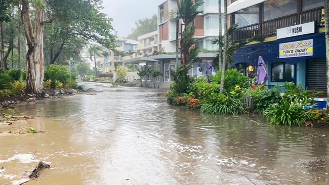 A large high tide and strong winds combined with the arrival of Tropical Cyclone Jasper in Far North Queensland to flood Williams Esplanade at Palm Cove, Cairns. Picture: Bronwyn Farr