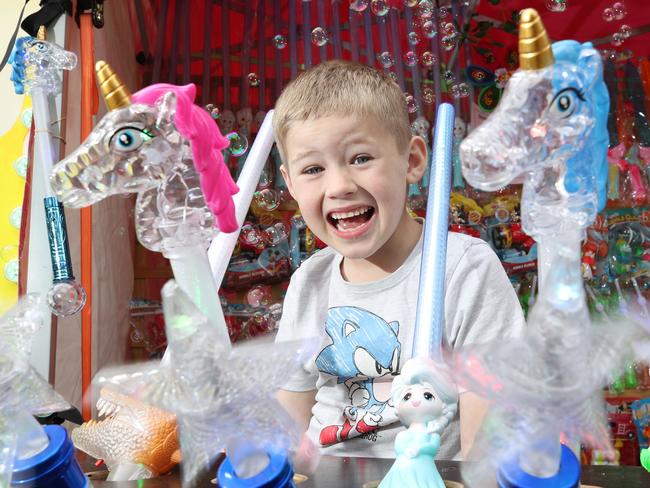 First day of the Gold coast Show. Jett Richards 6 helps mum sell toys..  . Picture Glenn Hampson