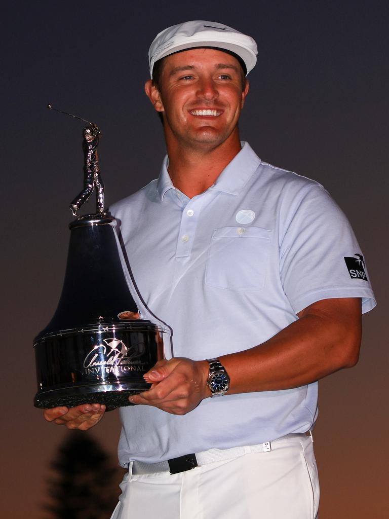 Bryson DeChambeau celebrates with the trophy. (Photo by Mike Ehrmann/Getty Images)