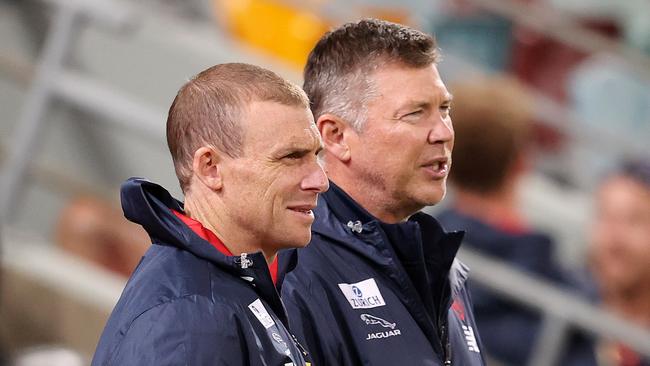 AFL Round 17. 12/09/2020. GWS Giants vs Melbourne at the Gabba, Brisbane. Simon Goodwin, senior coach of the Demons and CEO Gary Pert . Pic: Michael Klein