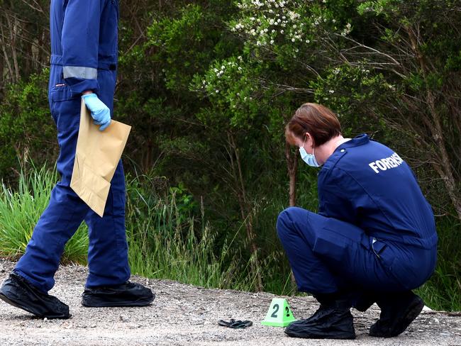 Forensic officers collecting evidence at the rural property. Picture: Nicole Garmston