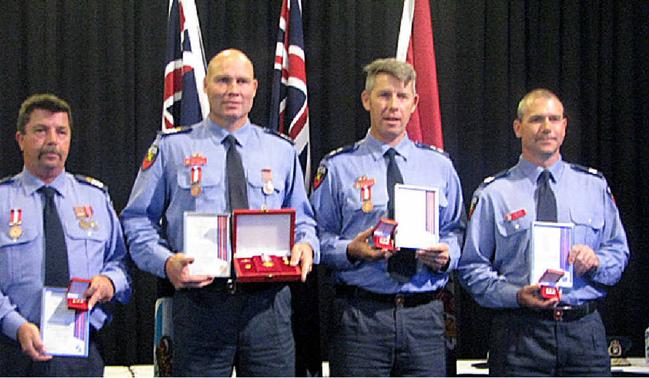 RECIPIENTS: Senior firefighters Bill Edgar and Tony Wildman, station officer Matt Phillips and firefighter Brad Izod. Picture: Contributed