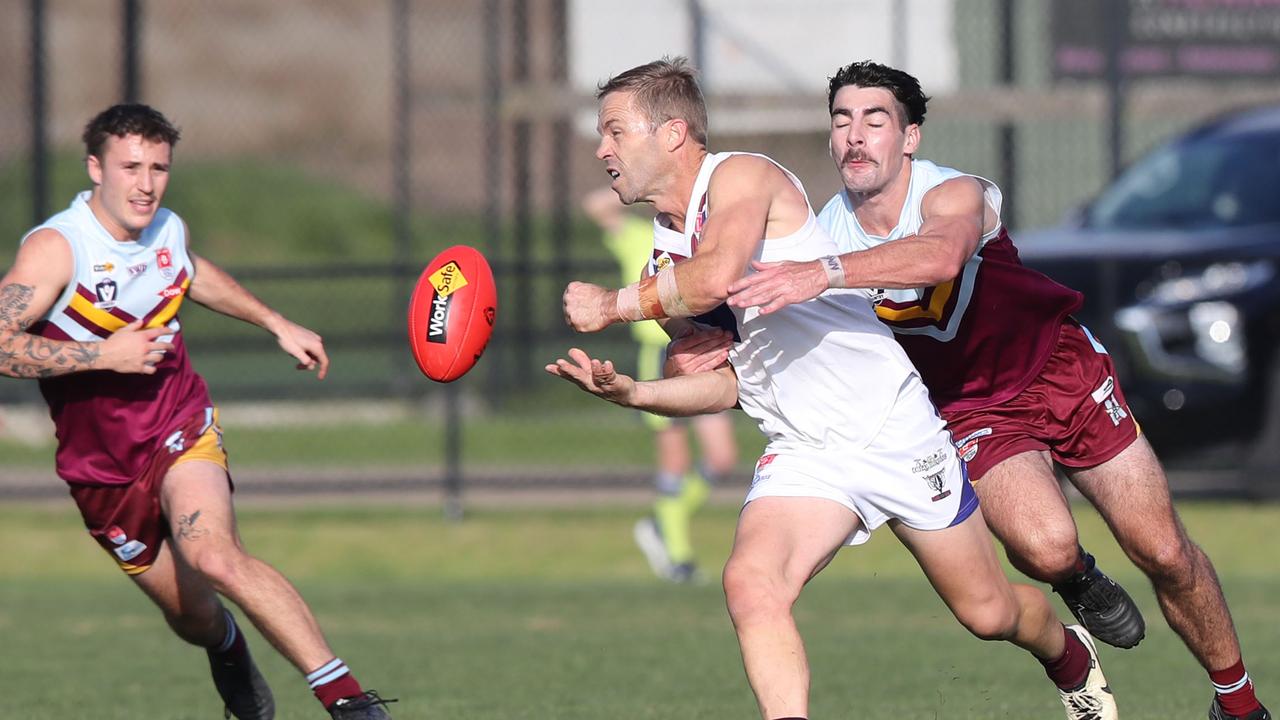 Josh Finch handballs for Modewarre. Picture: Alan Barber