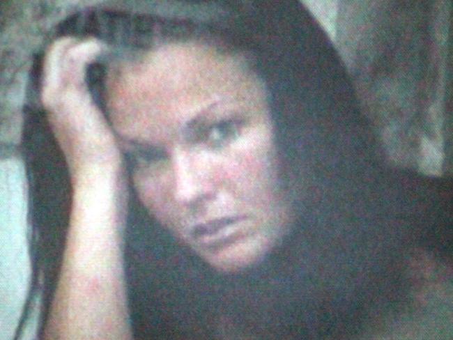 The first picture of Corby after her arrest was taken from a handycam inside the customs room at the airport. Picture: Supplied