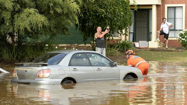 A car is submerged in water, after two water mains burst in Willow Drive, Paradise. Picture: Bianca De Marchi