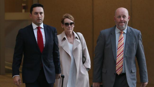 JM Kelly financial controller Elizabeth Murphy giving evidence in federal court into collapse of the building firm. Leaves court with lawyers. Tuesday 27th August 2019. (AAP Image – Richard Waugh)