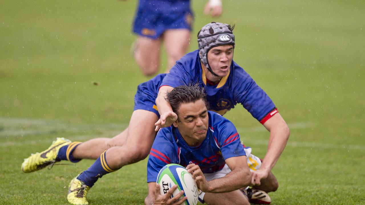 Harry Cooke, Grammar tackles Mitchell Willis, Downlands. O'Callaghan Cup at Toowoomba Grammar. Saturday, Aug 29, 2015. Photo Nev Madsen / The Chronicle