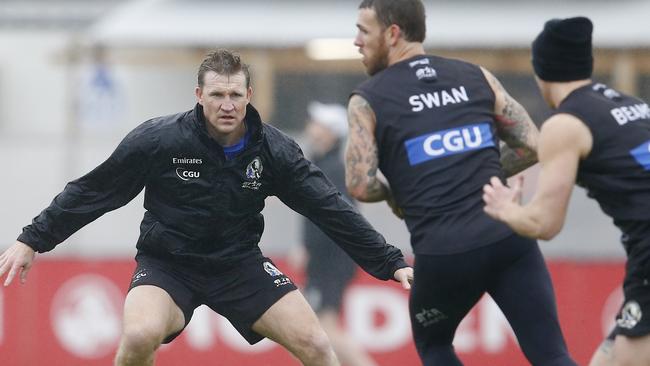 Coach Nathan Buckley plays the role of defender during a drill at Collingwood training today. Picture: Michael Klein