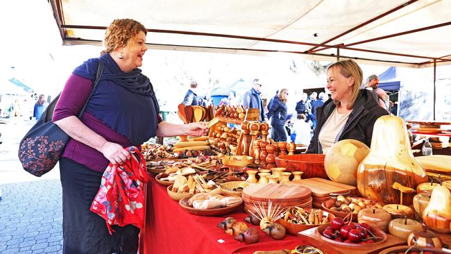 Hobart Lord Mayor, Anna Reynolds speaks with owner of Salamanca Wood Craft, Linda Fry. Picture: Zak Simmonds