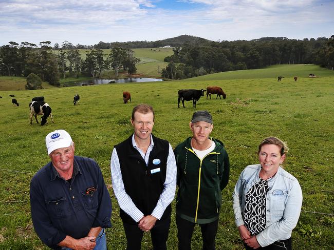 Organic dairy farmer Geoff Atkinson, Australian Consolidated Milk general manager- commercial Peter Jones, organic dairy farmers Matt and Andy Jackman at Howth. Picture: Chris Kidd