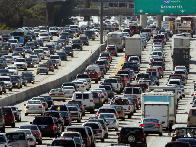 26/05/2010 WIRE: FILE - In this May 28, 2010 file photo, the rush hour commute starts in early afternoon and with greater intensity as traffic is jammed in both directions on Interstate 405 on the Westside of Los Angeles as commuters and vacationers hit the road.  (AP Photo/Reed Saxon, file)