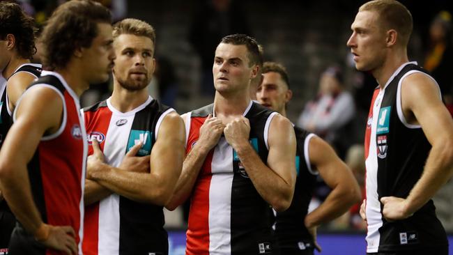 Brad Crouch and dejected teammates try and come to terms with the huge loss. Picture: AFL Photos