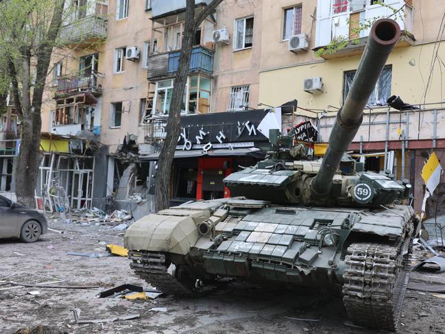 A tank is seen in front of a damaged building in Mariupol. Picture: Leon Klein/Anadolu Agency via Getty Images